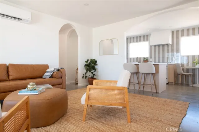 a view of a kitchen with granite countertop a sink and a window