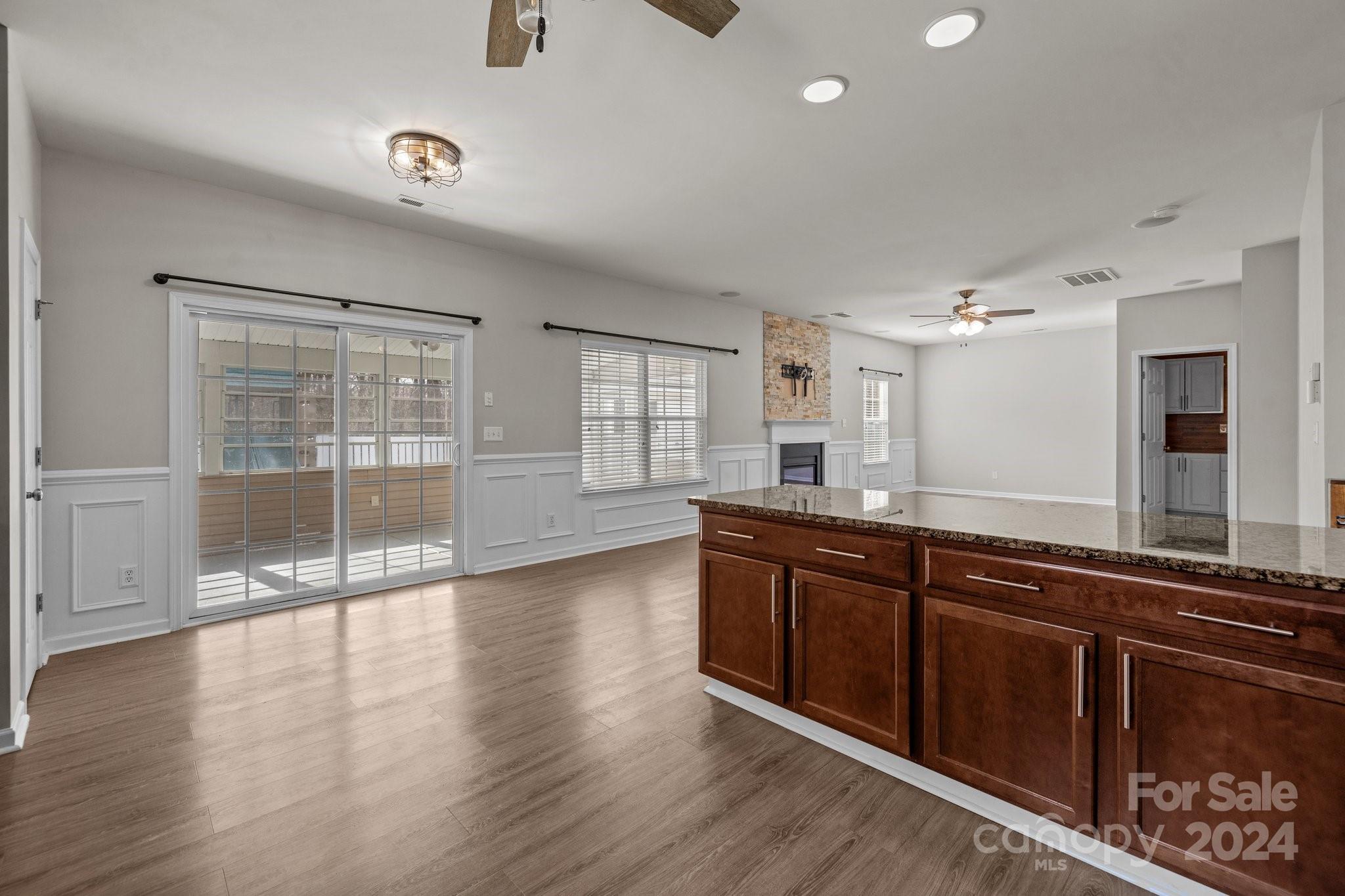 1653 Beleek Ridge Lane Clover, SC 29710 - Photo 14 of 46 a view of a kitchen island wooden floor and windows