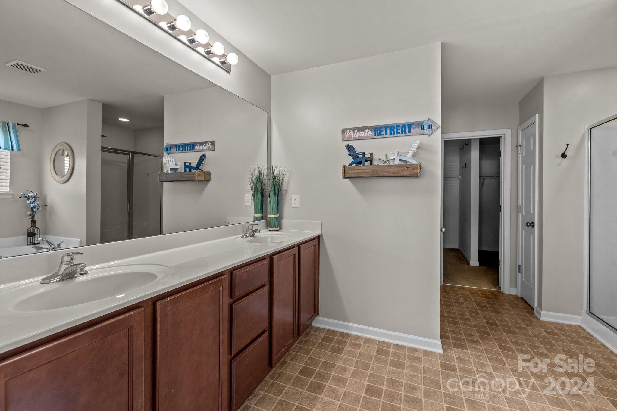 1653 Beleek Ridge Lane Clover, SC 29710 - Photo 26 of 46 a bathroom with a double vanity sink and a mirror