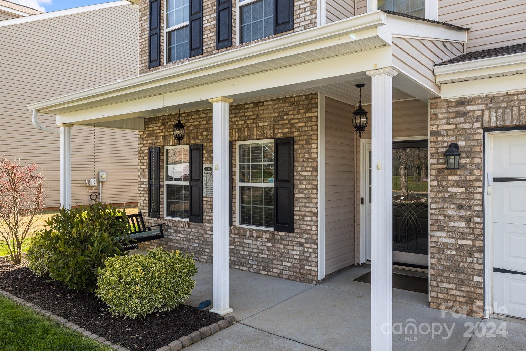 1653 Beleek Ridge Lane Clover, SC 29710 - Photo 3 of 46 front view of a brick house with a large windows