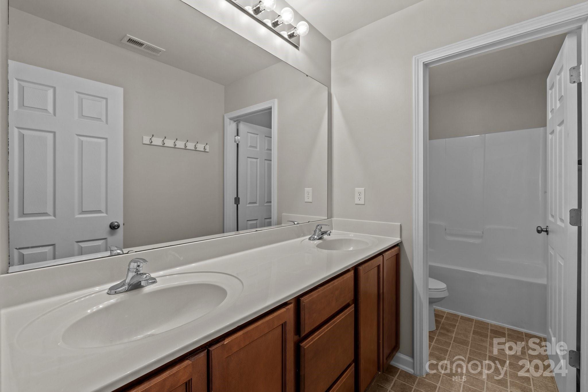 1653 Beleek Ridge Lane Clover, SC 29710 - Photo 32 of 46 a bathroom with a sink and a mirror