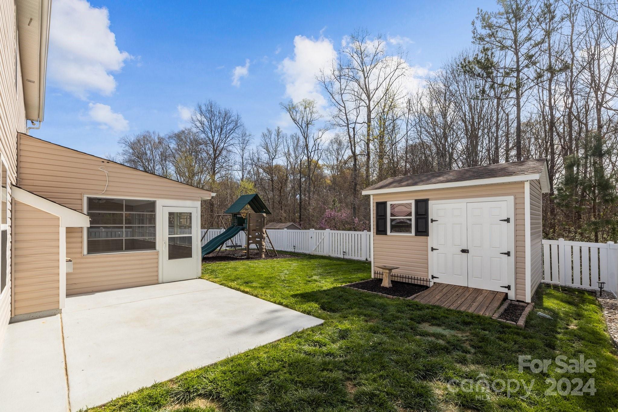 1653 Beleek Ridge Lane Clover, SC 29710 - Photo 35 of 46 a view of a house with backyard and trees