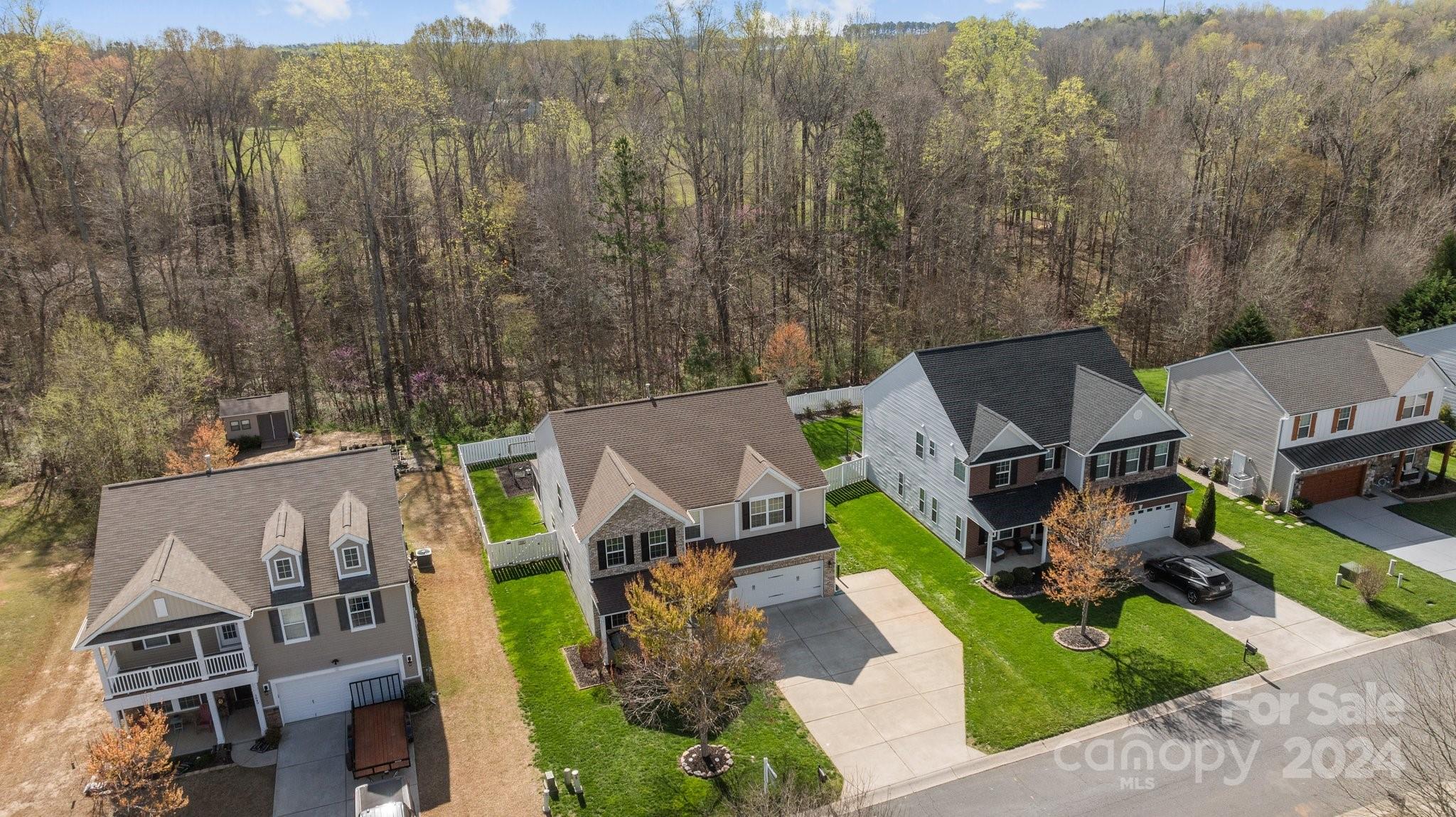1653 Beleek Ridge Lane Clover, SC 29710 - Photo 36 of 46 a aerial view of a house with swimming pool and large trees
