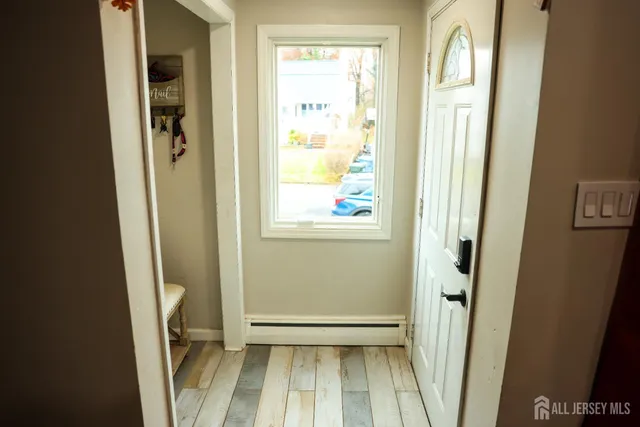 a view of front door with wooden floor