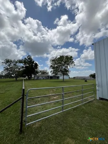 a view of a bench in the middle of a park