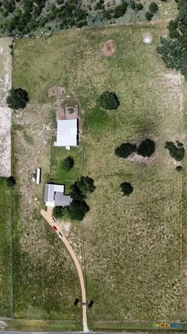 a aerial view of a house with a yard