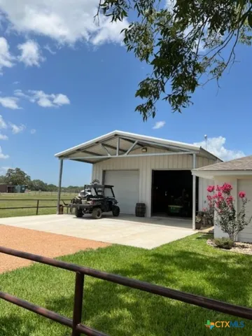 a view of a house with yard and entertaining space