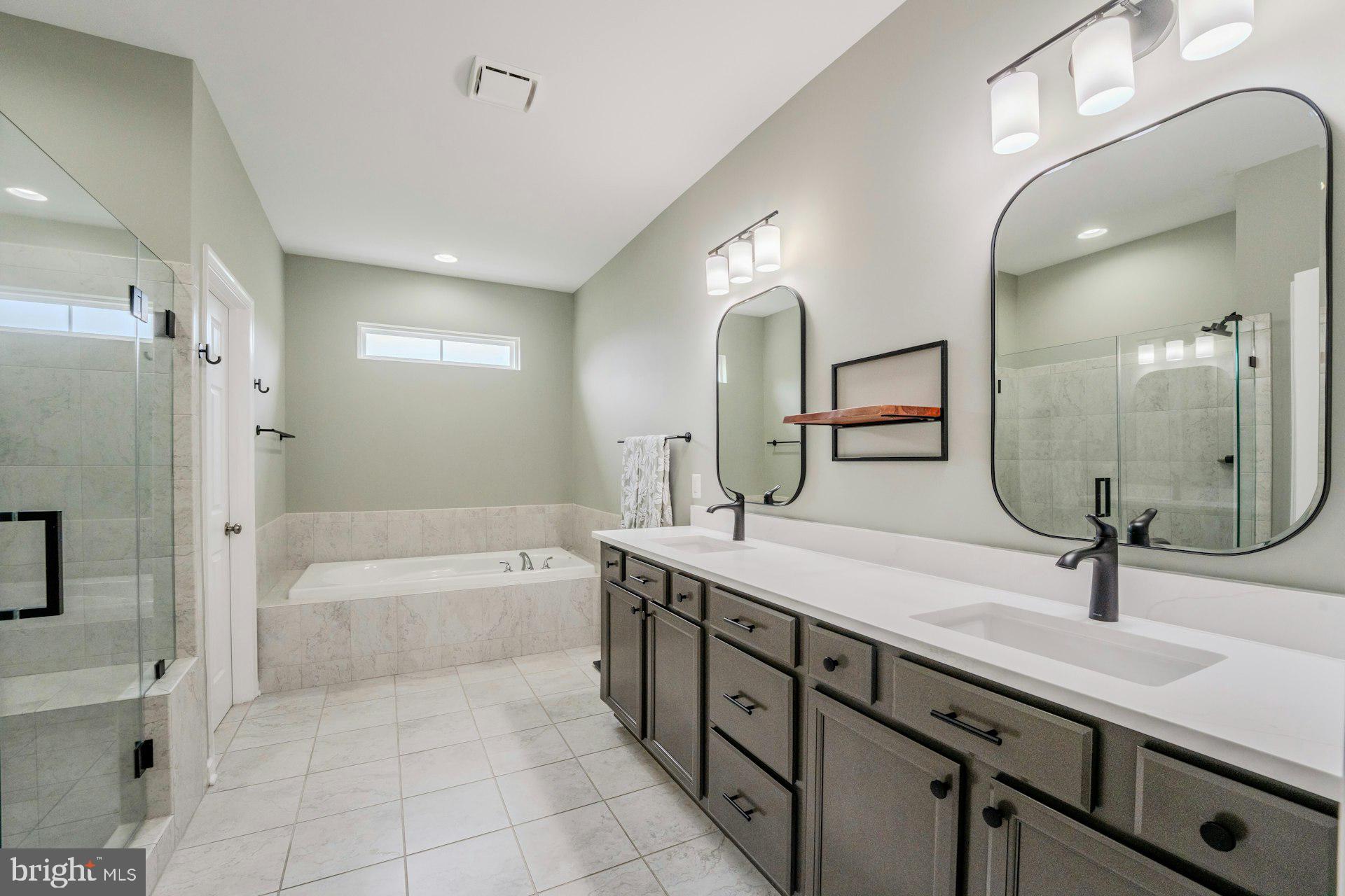 18120 Ridgewood Place Round Hill, VA 20141 - Photo 21 of 46 a spacious bathroom with a double vanity sink mirror double and bathtub