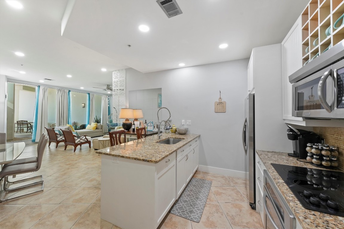 10327 Termini-San Luis Pass Road, Unit 319 Galveston, TX 77554 - Photo 10 of 28 Light and bright kitchen with stain less steel appliances.