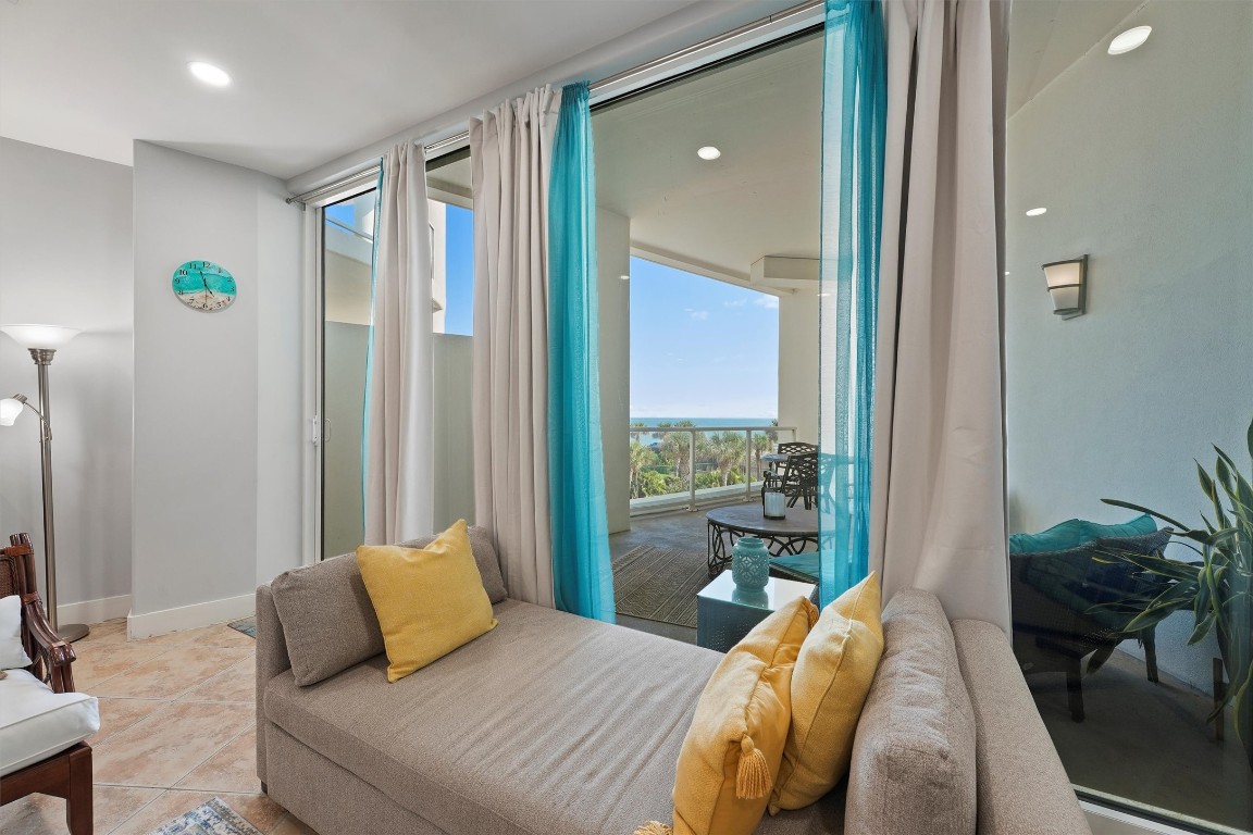 10327 Termini-San Luis Pass Road, Unit 319 Galveston, TX 77554 - Photo 4 of 28 Enjoy views from your living room! Wall to wall windows give the space such beautiful and bright natural light.