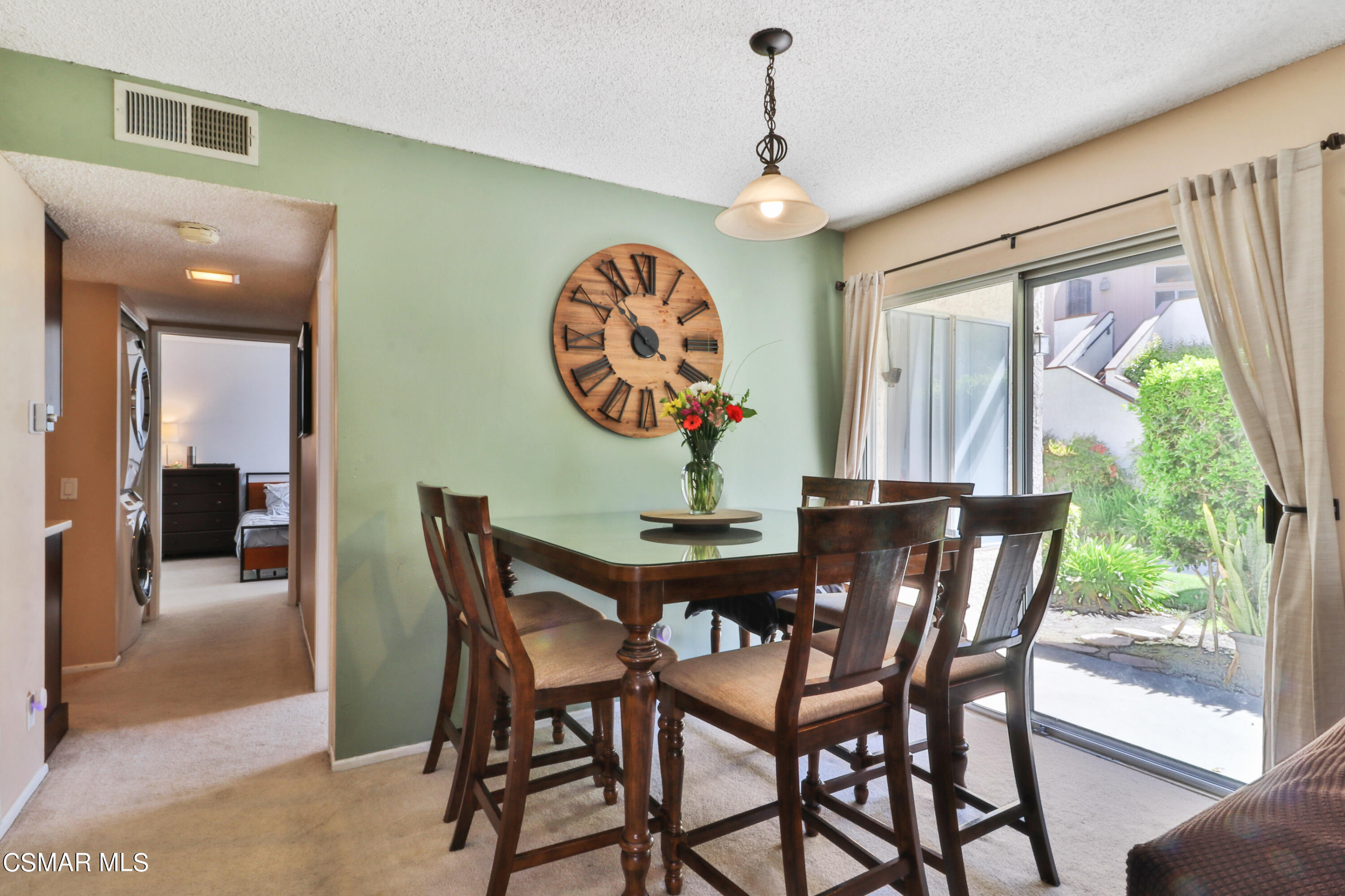 1724 Sinaloa Road, Unit 128 Simi Valley, CA 93065 - Photo 2 of 14 a dining room with furniture a large window and a chandelier