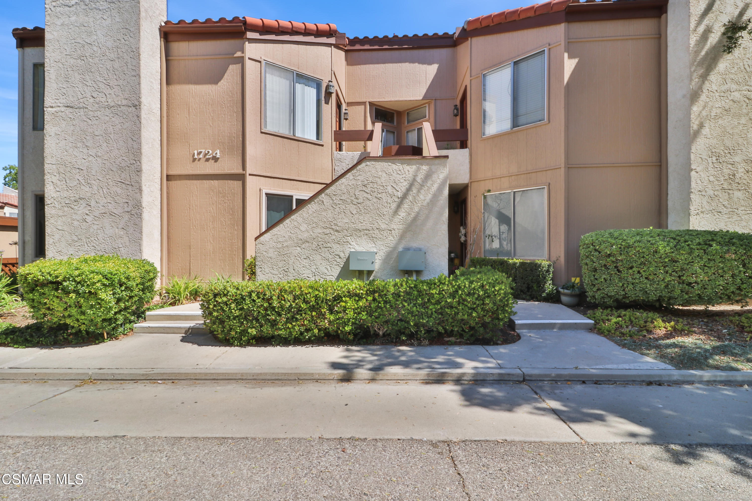 1724 Sinaloa Road, Unit 128 Simi Valley, CA 93065 - Photo 11 of 14 a view of a white apartments with large windows