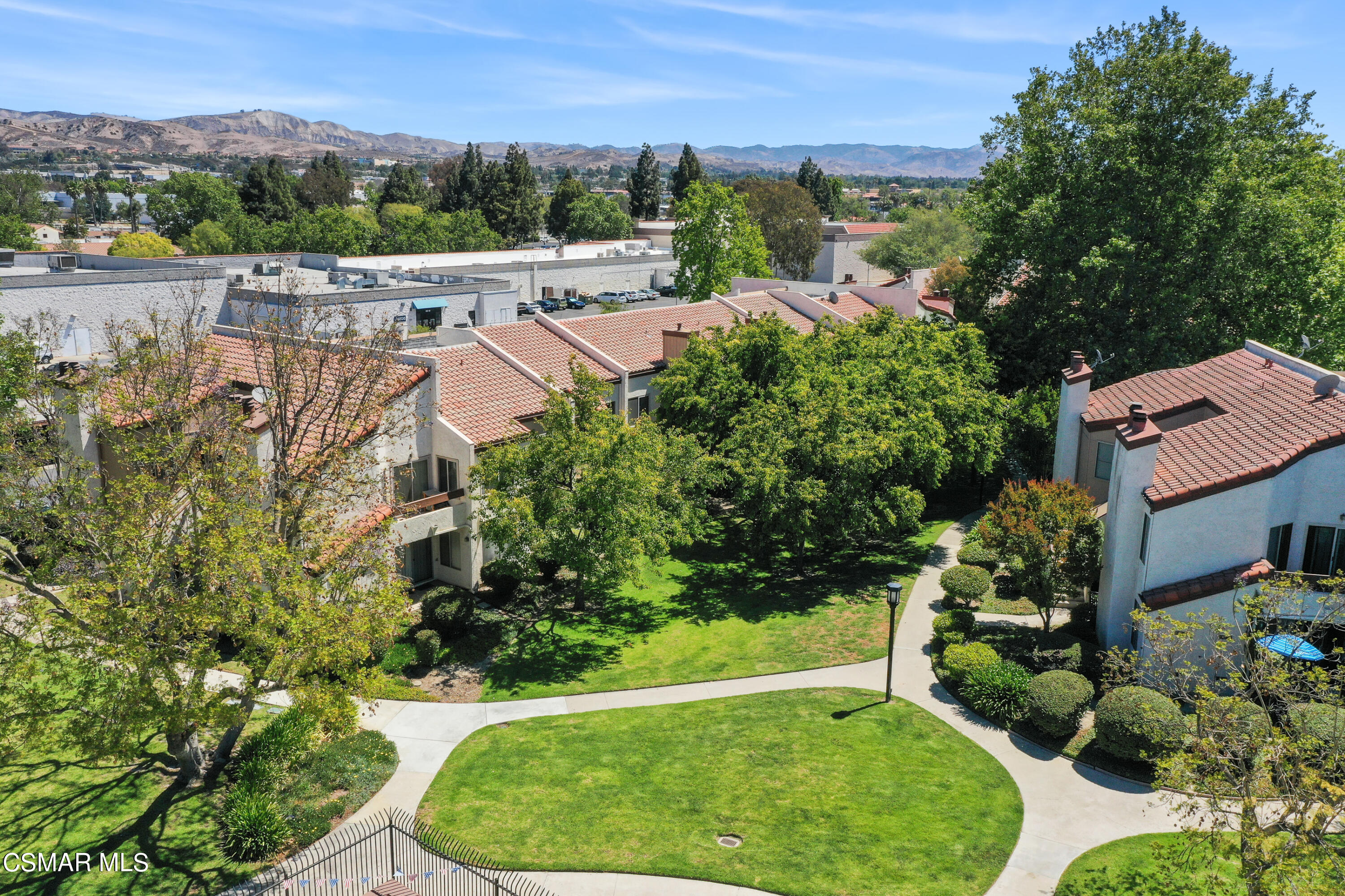 1724 Sinaloa Road, Unit 128 Simi Valley, CA 93065 - Photo 14 of 14 an aerial view of a house with a garden and lake view