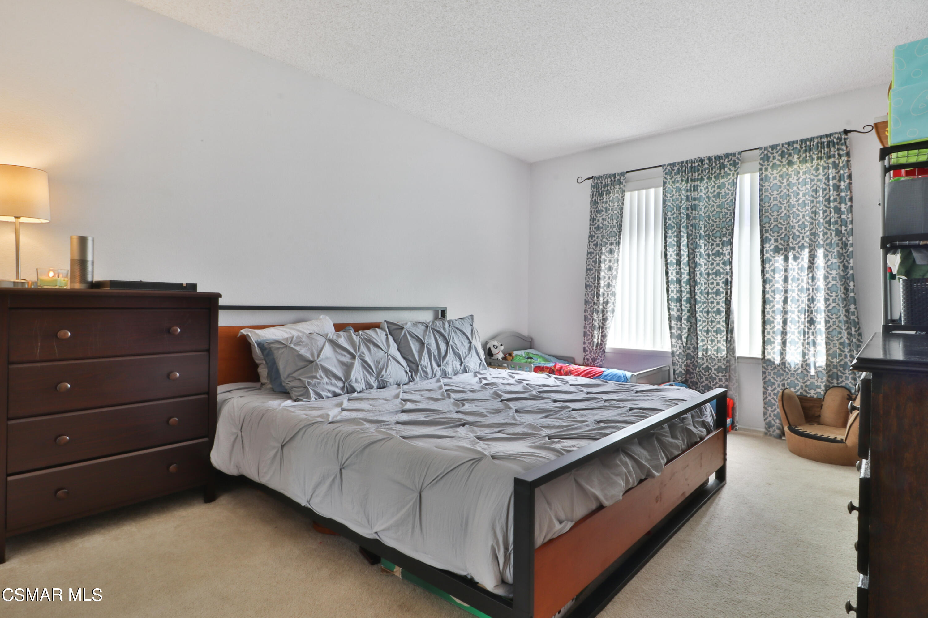 1724 Sinaloa Road, Unit 128 Simi Valley, CA 93065 - Photo 6 of 14 a bed sitting in a bedroom next to a window