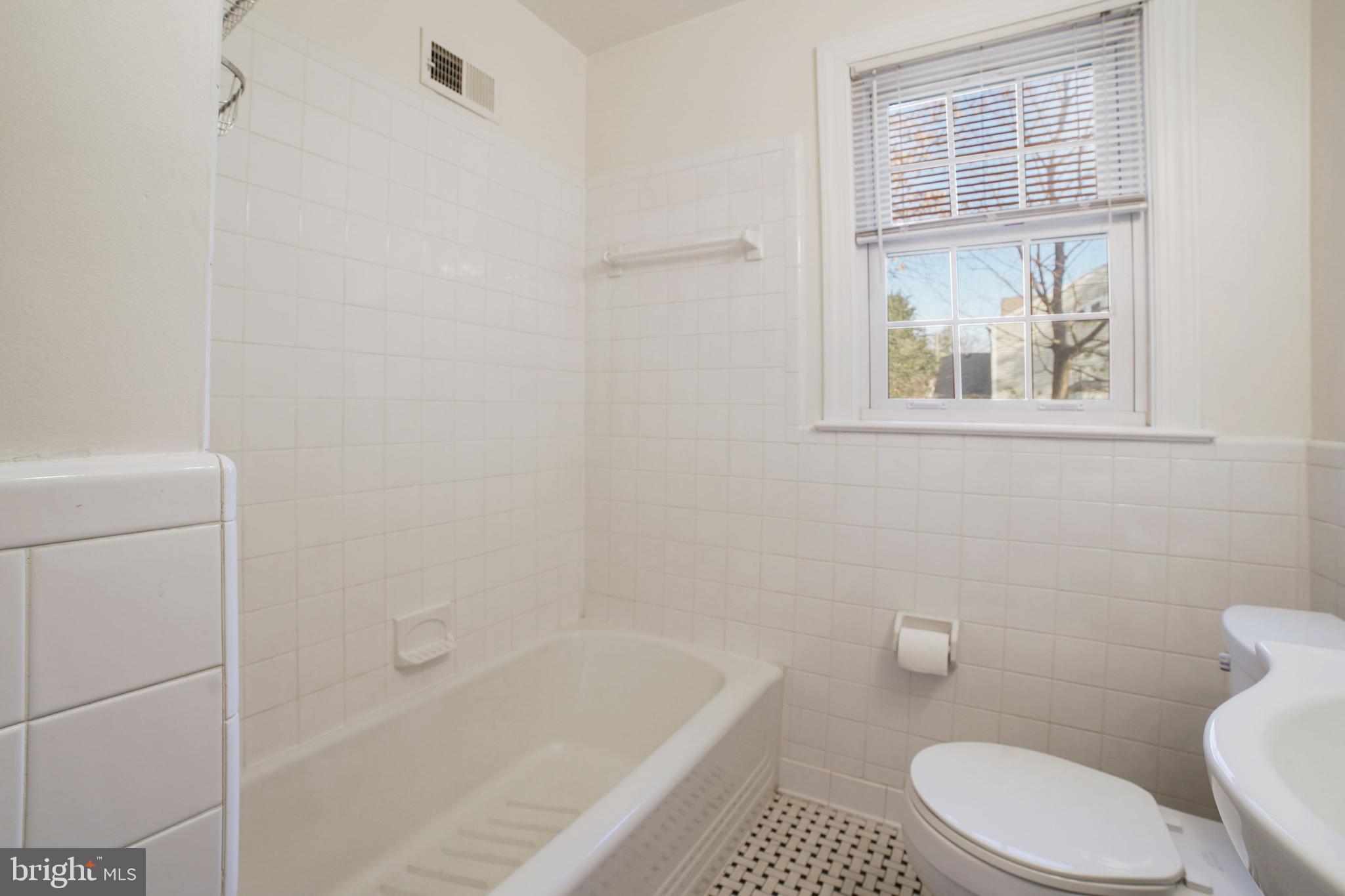 9905 Merwood Lane Silver Spring, MD 20901 - Photo 13 of 42 Freshly painted main level bath