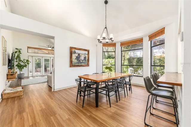 a kitchen with stainless steel appliances a stove a sink a microwave a refrigerator and cabinets