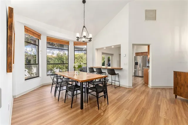 a kitchen with stainless steel appliances granite countertop a refrigerator a stove top oven a sink and dishwasher