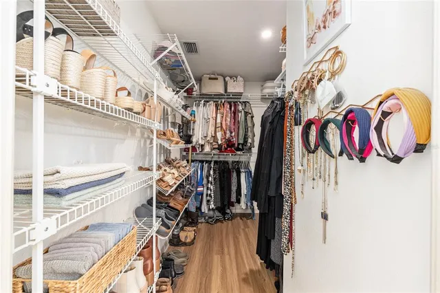 a bathroom with a bathtub sink vanity and mirror