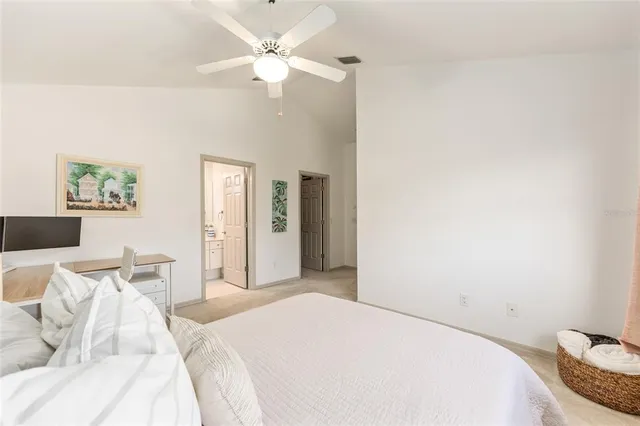 a dining room with furniture and a floor to ceiling window