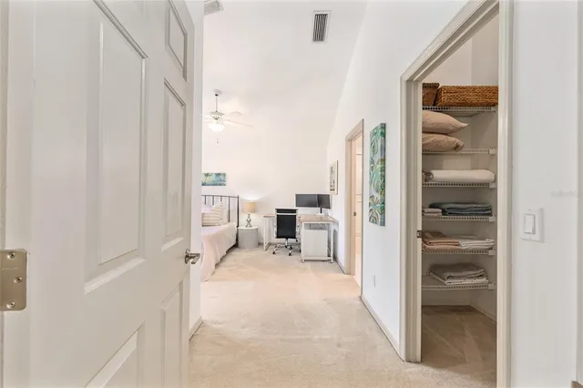a dining room with a wooden table and chairs