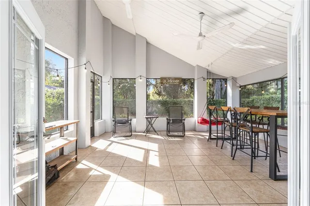 a view of livingroom with furniture and a refrigerator
