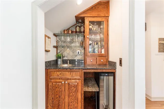 a kitchen with stainless steel appliances a refrigerator and a stove top oven