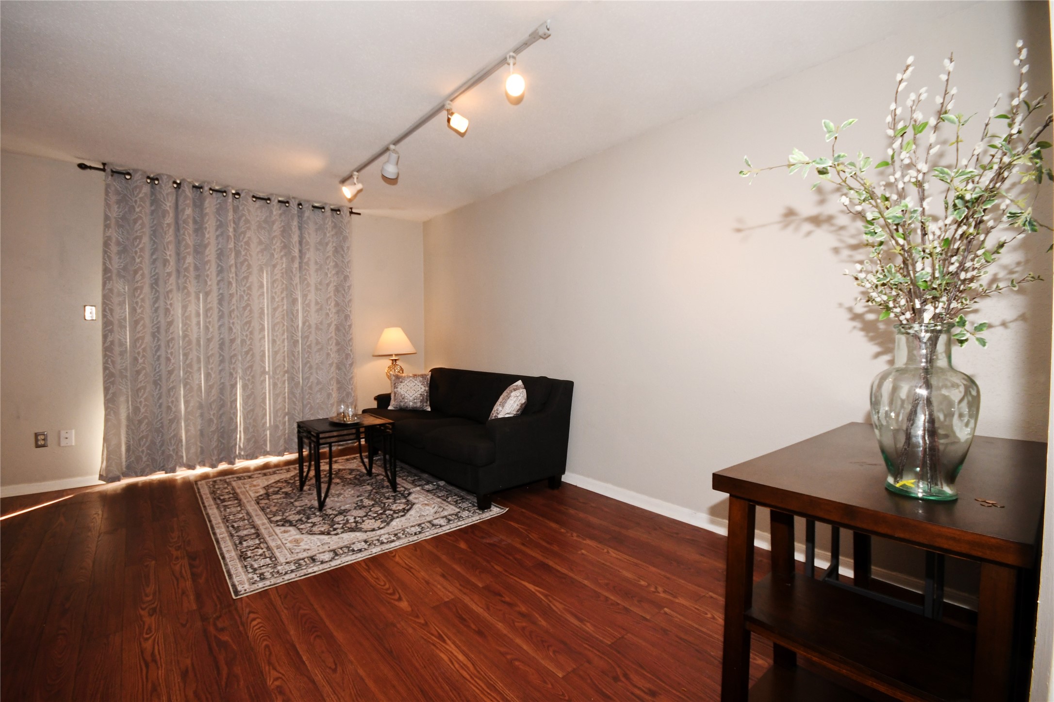 3401 Timmons Lane, Unit 12 Houston, TX 77027 - Photo 2 of 9 The living room features adjustable downlights for soft lighting for you to create your own touch of charm.