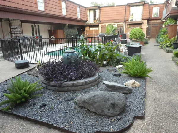 a view of a backyard with sitting area