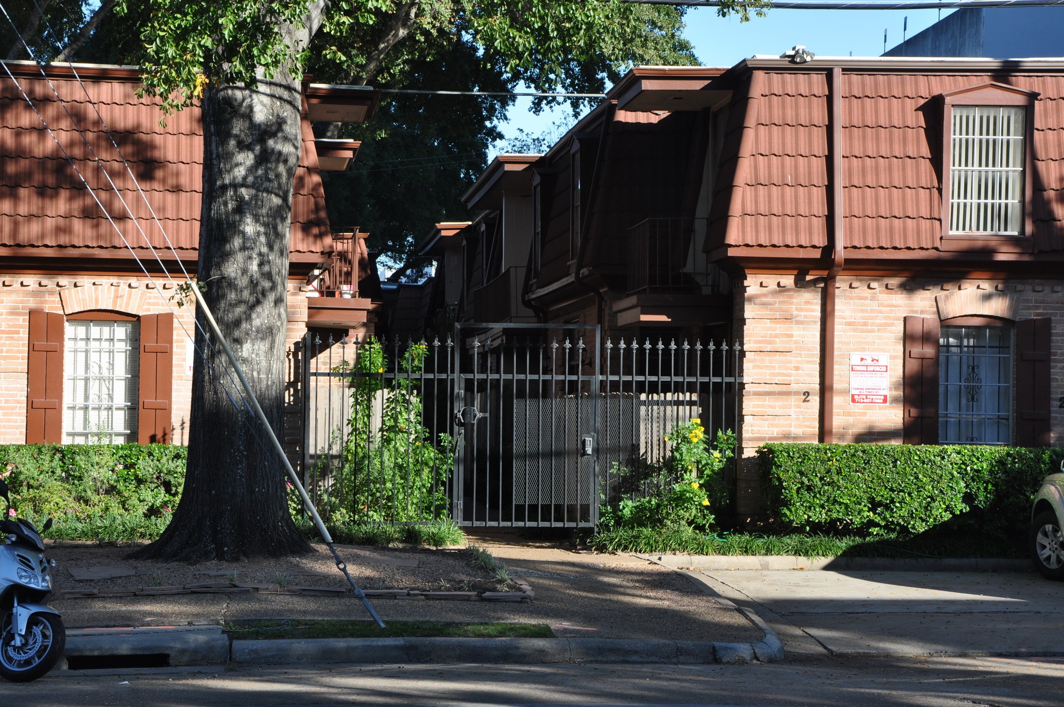 3401 Timmons Lane, Unit 12 Houston, TX 77027 - Photo 9 of 9 A gated entrance provides security and privacy. The style is classic with a warm, inviting exterior.
