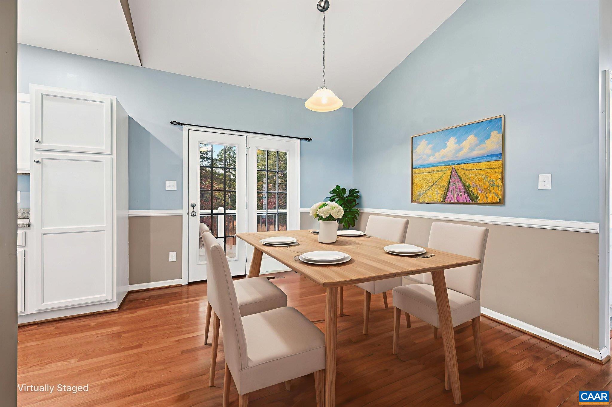 2093 Swift Run Road Ruckersville, VA 22968 - Photo 12 of 57 a view of a dining room with furniture window and wooden floor