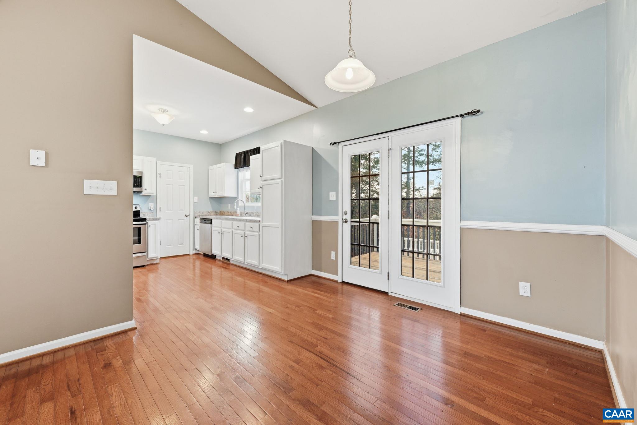2093 Swift Run Road Ruckersville, VA 22968 - Photo 14 of 57 a view of empty room with wooden floor and windows