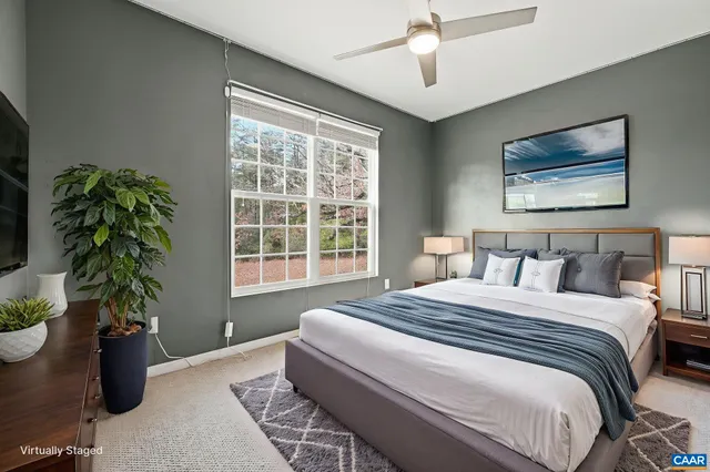 a view of a workspace with furniture and a potted plant