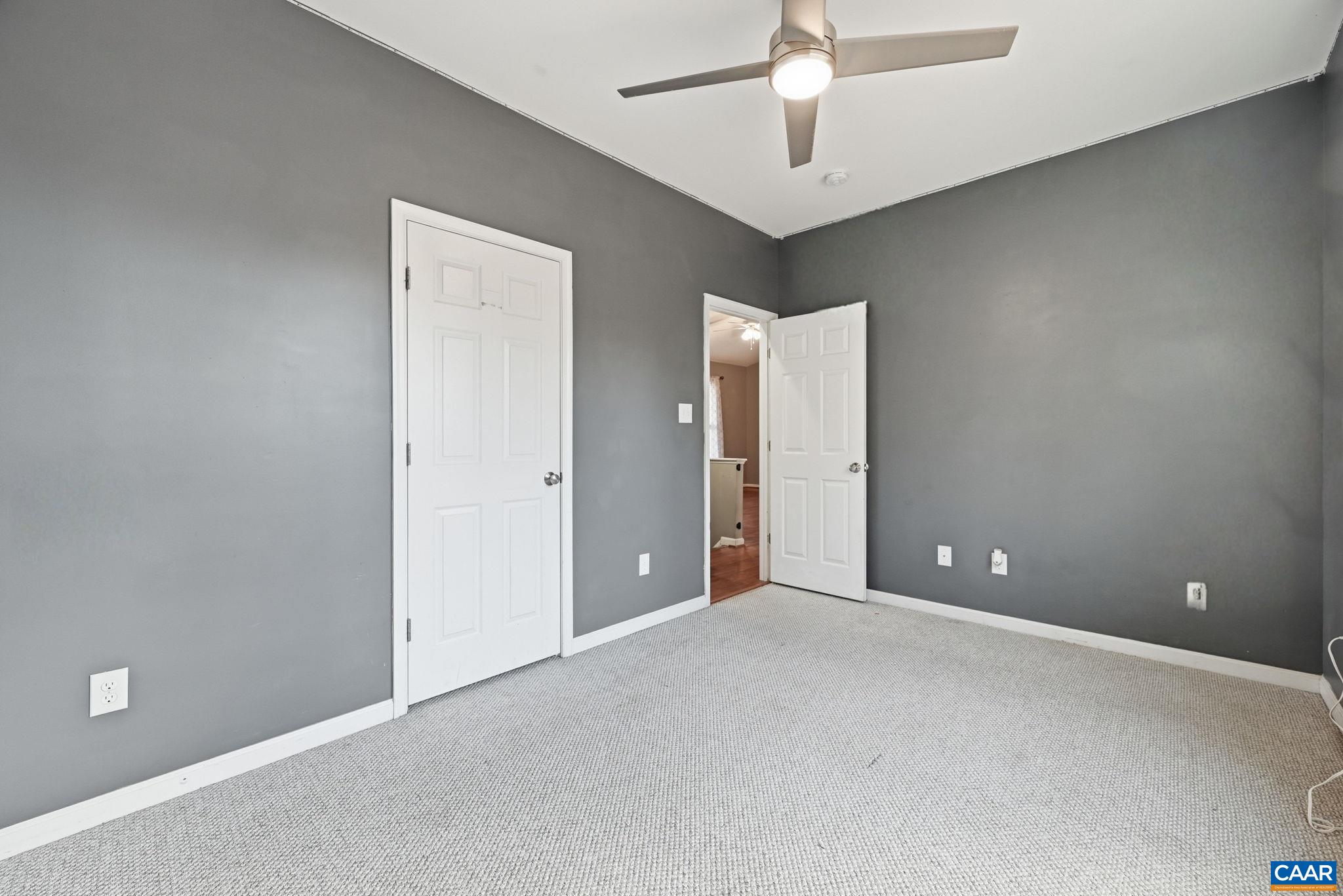2093 Swift Run Road Ruckersville, VA 22968 - Photo 31 of 57 a view of an empty room with a ceiling fan