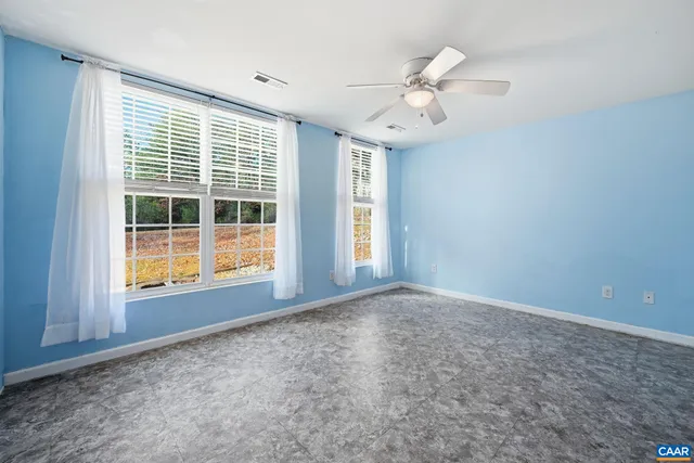 a utility room with dryer washer and a view of kitchen