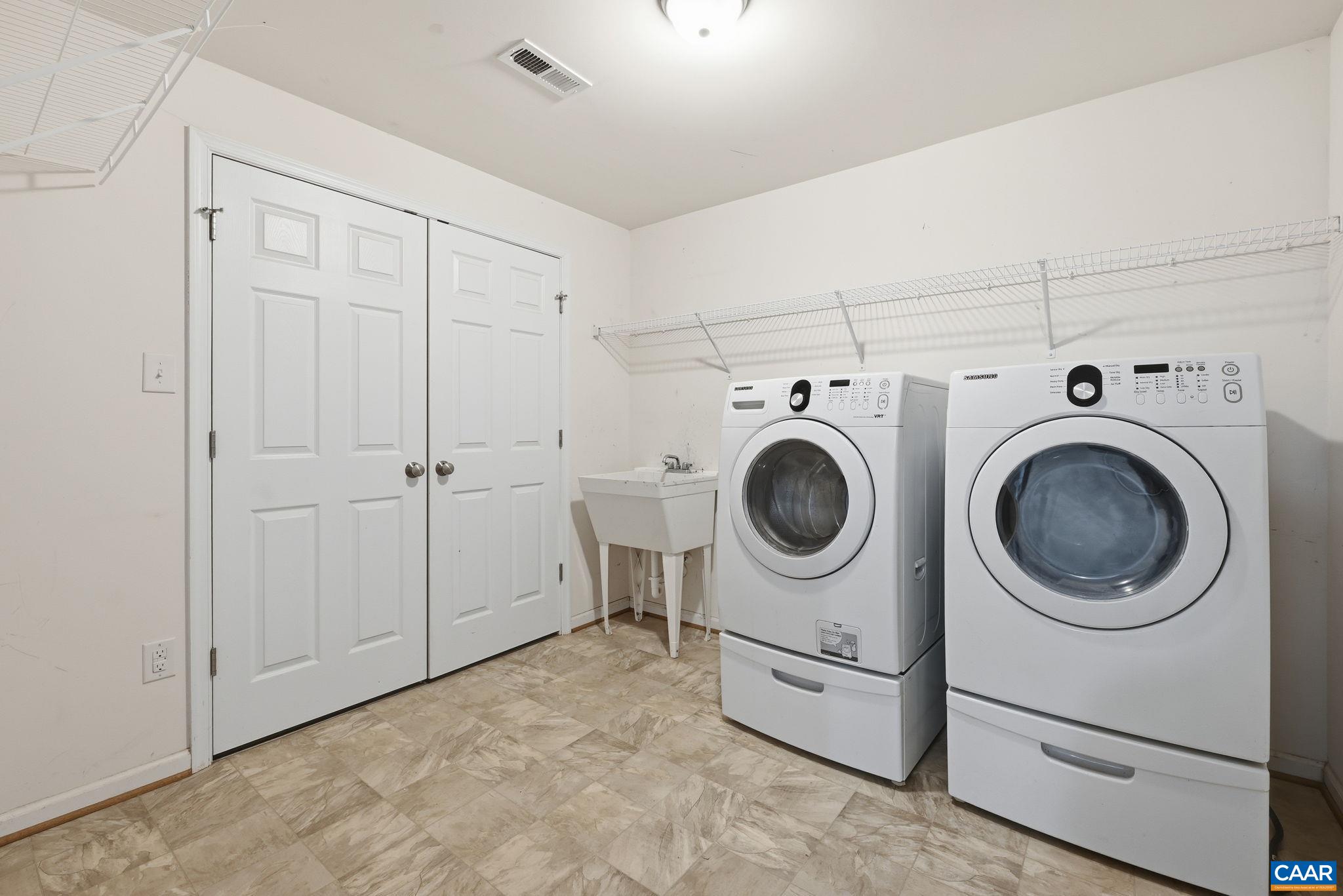 2093 Swift Run Road Ruckersville, VA 22968 - Photo 36 of 57 a utility room with dryer washer and a view of kitchen