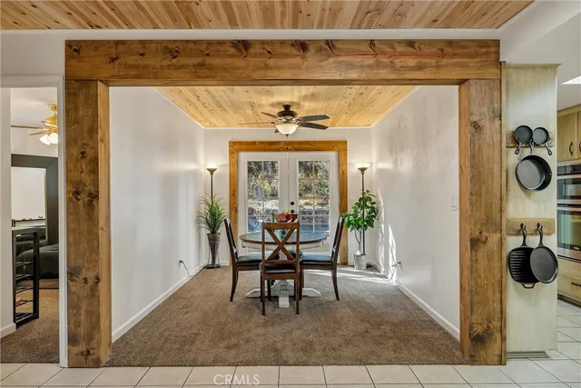 a kitchen with white cabinets and appliances