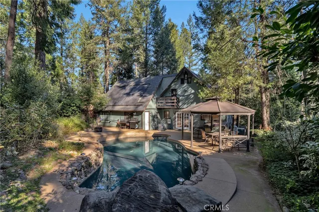 a backyard of a house with multiple trees