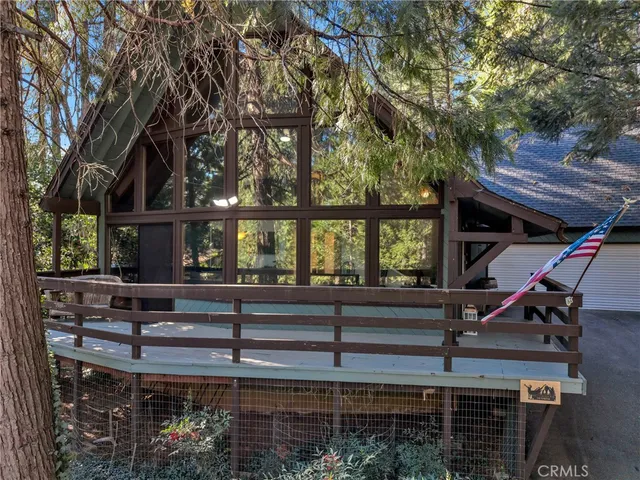 a view of a chairs and table in a backyard