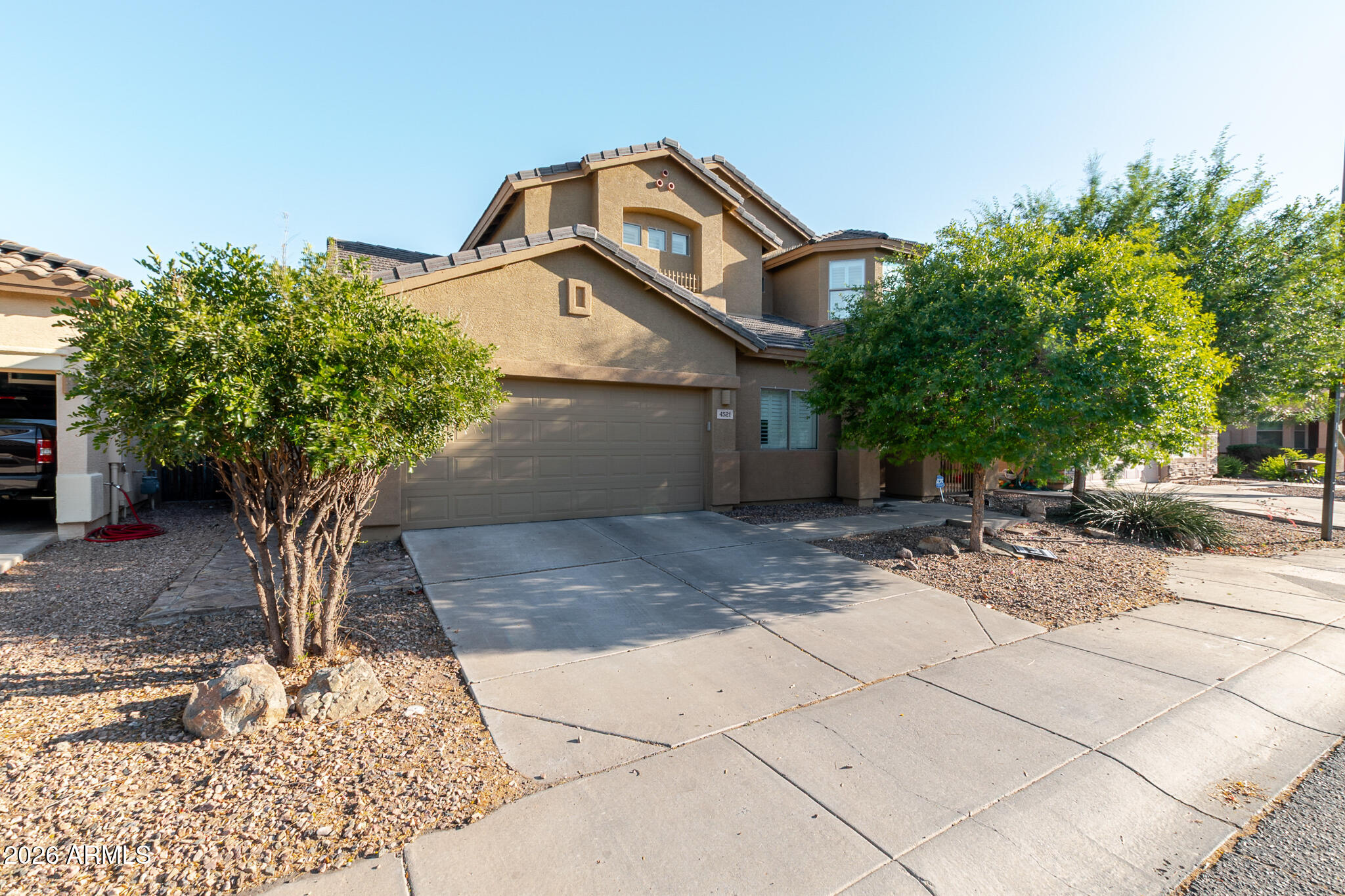 4521 West Moss Springs Road Anthem, AZ 85086 - Photo 6 of 35 a front view of a house with garden