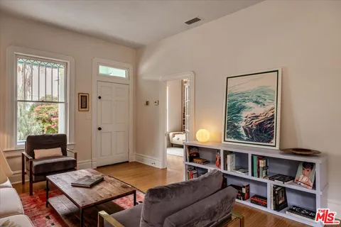 a bedroom with a bed furniture and a window