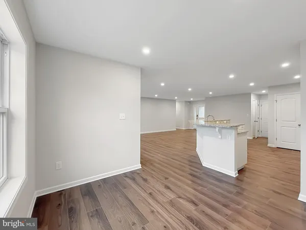 a view of kitchen and kitchen with wooden floor