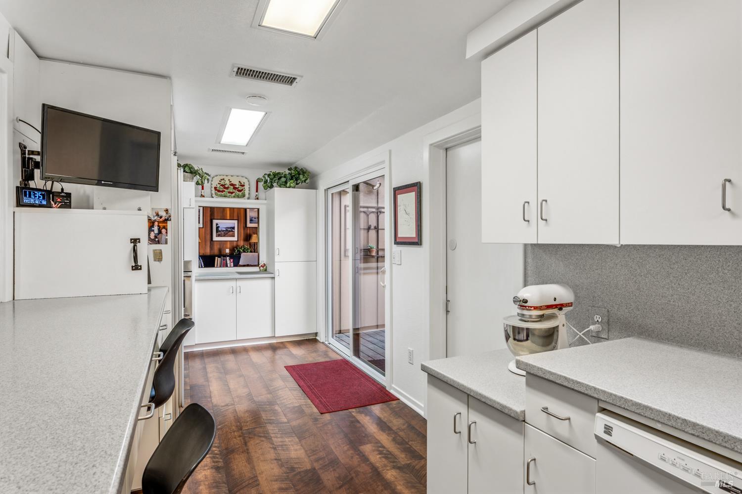 308 Jefferson Lane Ukiah, CA 95482 - Photo 14 of 50 a kitchen with stainless steel appliances a refrigerator and a stove top oven
