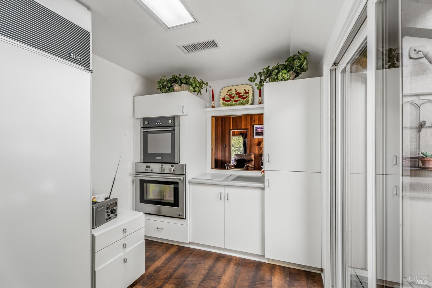 308 Jefferson Lane Ukiah, CA 95482 - Photo 16 of 50 a kitchen with granite countertop white cabinets and stainless steel appliances