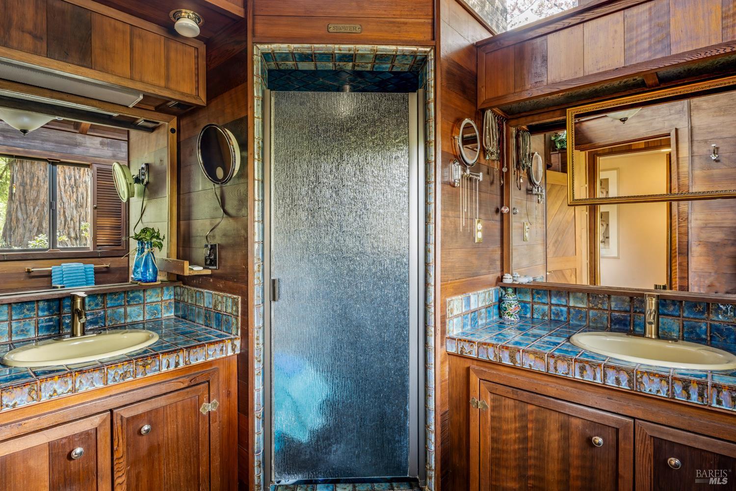 308 Jefferson Lane Ukiah, CA 95482 - Photo 21 of 50 a bathroom with a granite countertop sink a mirror and a shower