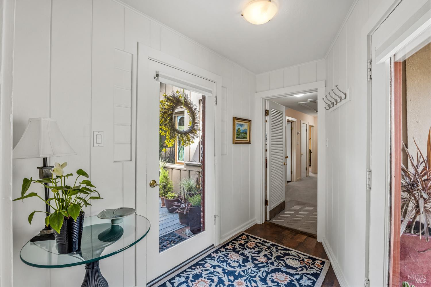 308 Jefferson Lane Ukiah, CA 95482 - Photo 26 of 50 a glass door with a potted plant