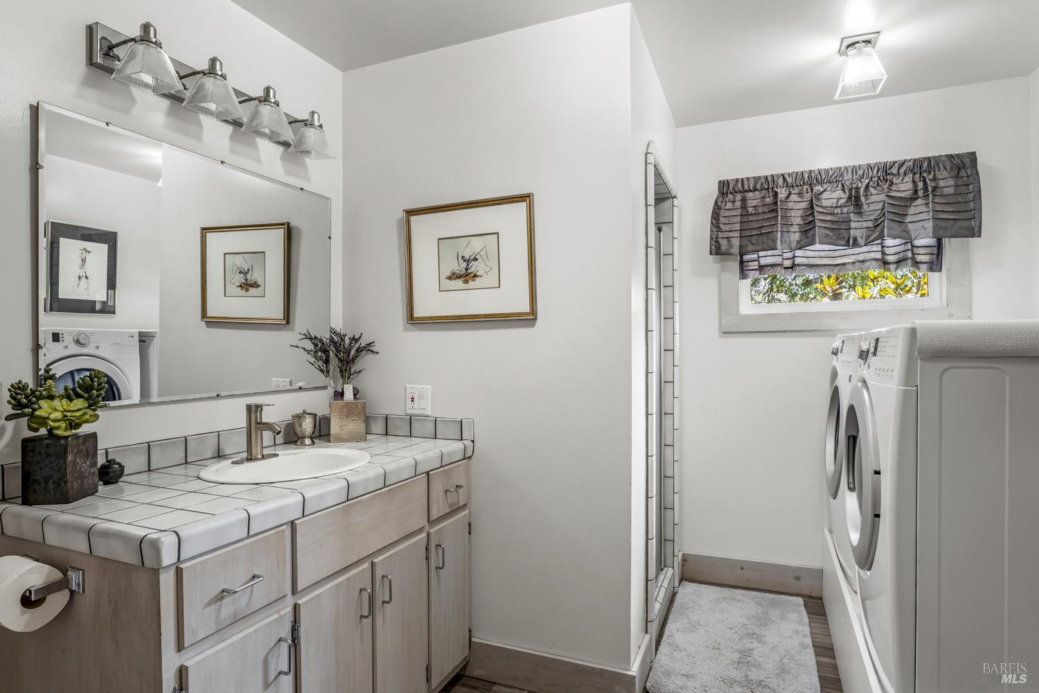 308 Jefferson Lane Ukiah, CA 95482 - Photo 30 of 50 a bathroom with a sink and a mirror