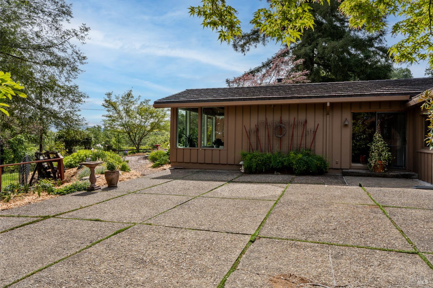 308 Jefferson Lane Ukiah, CA 95482 - Photo 38 of 50 a view of house with outdoor seating and covered with trees