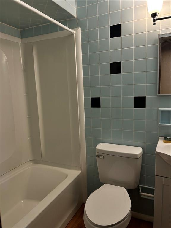 135 Union Street Bridgeville, PA 15017 - Photo 3 of 6 a white toilet sitting next to a bath tub