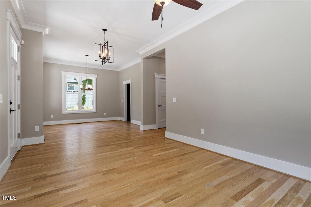 3934 Old Chapel Hill Road Durham, NC 27707 - Photo 13 of 47 wooden floor in an empty room with a window
