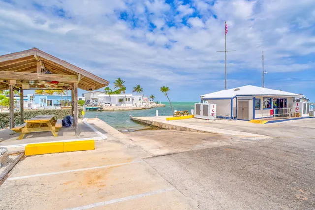 a view of swimming pool with sitting area